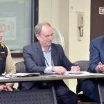U.S. Rep. Derek Kilmer, right, discusses emergency services on Thursday during a roundtable session with emergency managers from across the region, including Clallam County Sheriff Brian King, left, and Clallam County Administrator Todd Mielke in Port Angeles. (Keith Thorpe/Peninsula Daily News)