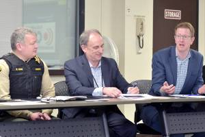 U.S. Rep. Derek Kilmer, right, discusses emergency services on Thursday during a roundtable session with emergency managers from across the region, including Clallam County Sheriff Brian King, left, and Clallam County Administrator Todd Mielke in Port Angeles. (Keith Thorpe/Peninsula Daily News)