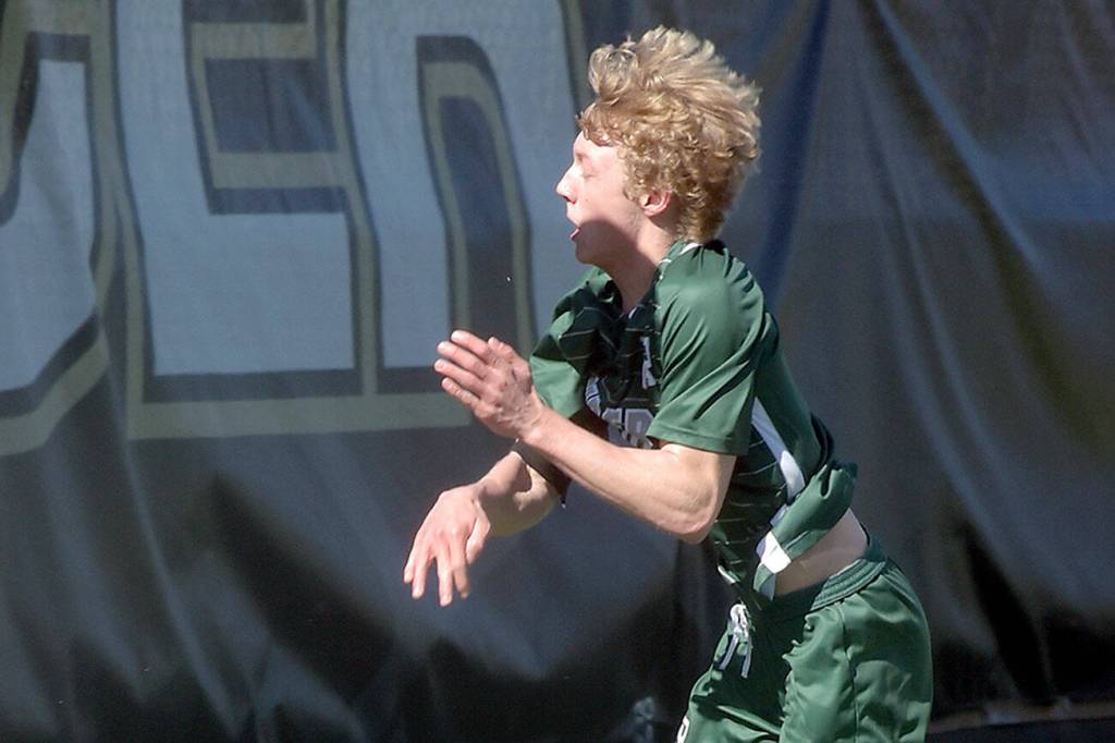 KEITH THORPE/PENINSULA DAILY NEWS
Port Angeles' Matthew Miller trips over Klahowya goalkeeper Rezyn Moore in a charge to the net on Saturday afternoon in Port Angeles.