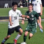 KEITH THORPE/PENINSULA DAILY NEWS
Port Angeles' Daniel Blondolillo, right, fights for control with Klahowya's J.J. Quinones, left, as Klahowya's Elijah Body looks on during Saturday's match in Port Angeles.