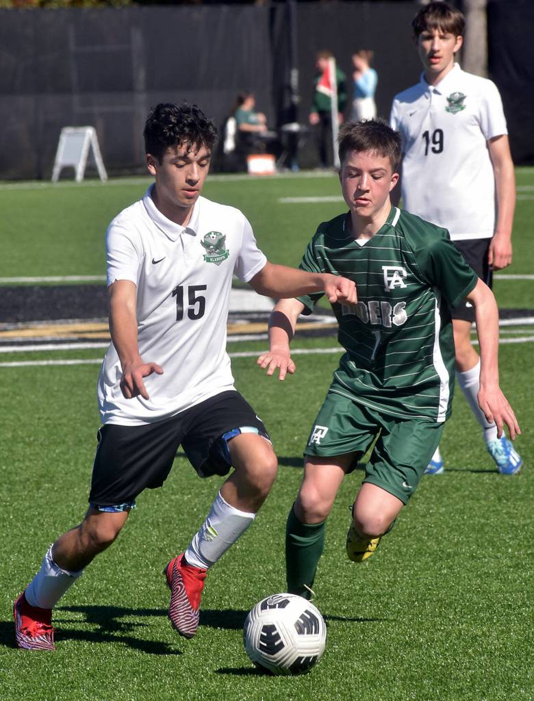 KEITH THORPE/PENINSULA DAILY NEWS
Port Angeles' Daniel Blondolillo, right, fights for control with Klahowya's J.J. Quinones, left, as Klahowya's Elijah Body looks on during Saturday's match in Port Angeles.