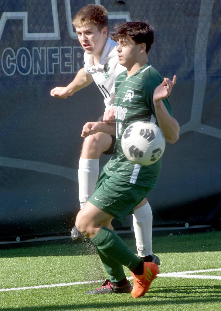 KEITH THORPE/PENINSULA DAILY NEWS
Port Angeles' Oliver Martinez, front, gets between the ball and Klahowya's Sage Bell on Saturday at Peninsula College.