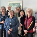 From left to right are flutists Mary Ann Hagan, Janet See, Molly Warner, Marty Ronish, Liz Hunter, Nayoung Ham, Carla Lawrence and Miguel Rodé.