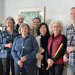 From left to right are flutists Mary Ann Hagan, Janet See, Molly Warner, Marty Ronish, Liz Hunter, Nayoung Ham, Carla Lawrence and Miguel Rodé.