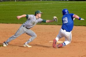 KEITH THORPE/PENINSULA DAILY NEWS
Port Angeles shortstop Alex Angevine, left, catches Olympic's Landon Nicholson on a second base steal attempt for an out during Thursday's game at Port Angeles Civic Field.