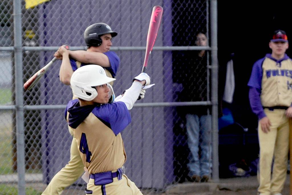 Michael Dashiell/Olympic News Group
Sequim's Bryant Laboy laces a single into left field during the Wolves' contest with North Kitsap on Thursday.