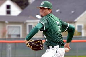 KEITH THORPE/PENINSULA DAILY NEWS
Port Angeles pitcher Brian Guttormsen throws in the first inning against Peninsula on Saturday at Port Angeles Civic Field.