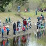 (Above) Dozens of kids from all around the Olympic Peninsula came out to the Lincoln Park ponds Saturday morning at the annual Kids' Fishing Derby sponsored by the Olympic Peninsula Fly Fishers. The Kiwanis, Les Schwab, Re/Max Realty and Swain’s General Store are all supported the event with the Kiwanis Club serving hot dogs. (Dave Logan/for Peninsula Daily News)