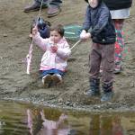 KEITH THORPE/PENINSULA DAILY NEWS Rosalee Stark, 3, and her brother, Hunter Olson, 7, both of Port Angeles, try their hands with rods and reels during Saturdays Kids Fishing Derby at the Lincoln Park ponds. The event, sponsored by the Olympic Peninsula Fly Fishers, drew hundreds of young anglers and their parents to the park for prizes and the joy of pulling in fish.