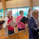 Sopranos rehearsing, back row, from left, Beth Cahape, Annalee McConnell, Joan Coyne and Amy Johnson; front row, from left, Judy Backman, Mardelle Hansen and Mar Oneppo.