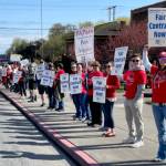 Members of the Port Angeles Paraeducators Association gather on Lincoln Street on Sunday morning, a day before a planned strike if an agreement cannot be reached with the Port Angeles School District over a new contract. (Paula Hunt/Peninsula Daily News)