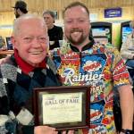 Laurel Lanes owner Vern Elkhart with Port Angeles Business Association president Anthony Sanders receiving his hall of fame plaque back in January. (Courtesy photo)