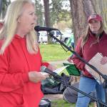 Retired teacher Nancy McCaleb speaks in support of striking paraeducators in the Port Angeles School District as Port Angeles Paraeducators Association President Rebecca Winters listens during a rally on Thursday at Shane Park. (KEITH THORPE/PENINSULA DAILY NEWS)