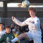 KEITH THORPE/PENINSULA DAILY NEWS
Sequim's Finn Braaten, front, takes a header as Port Angeles' A.J. Martinez keeps watch on Thursday at Peninsula College.