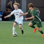KEITH THORPE/PENINSULA DAILY NEWS Sequims Max Stanford, left, dribbeles past Port Angeles Aurelio Wilson-Rojero on Tuesday in Port Angeles.