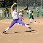 Dave Logan/for Peninsula Daily News
Sequim pitcher Nevaeh Owens delivers to the plate while Port Angeles baserunner first Lexie Smith gets ready to take off. Sequim first baseman Rylie Doig also in on the play as the No. 1-ranked Roughriders won 14-2.