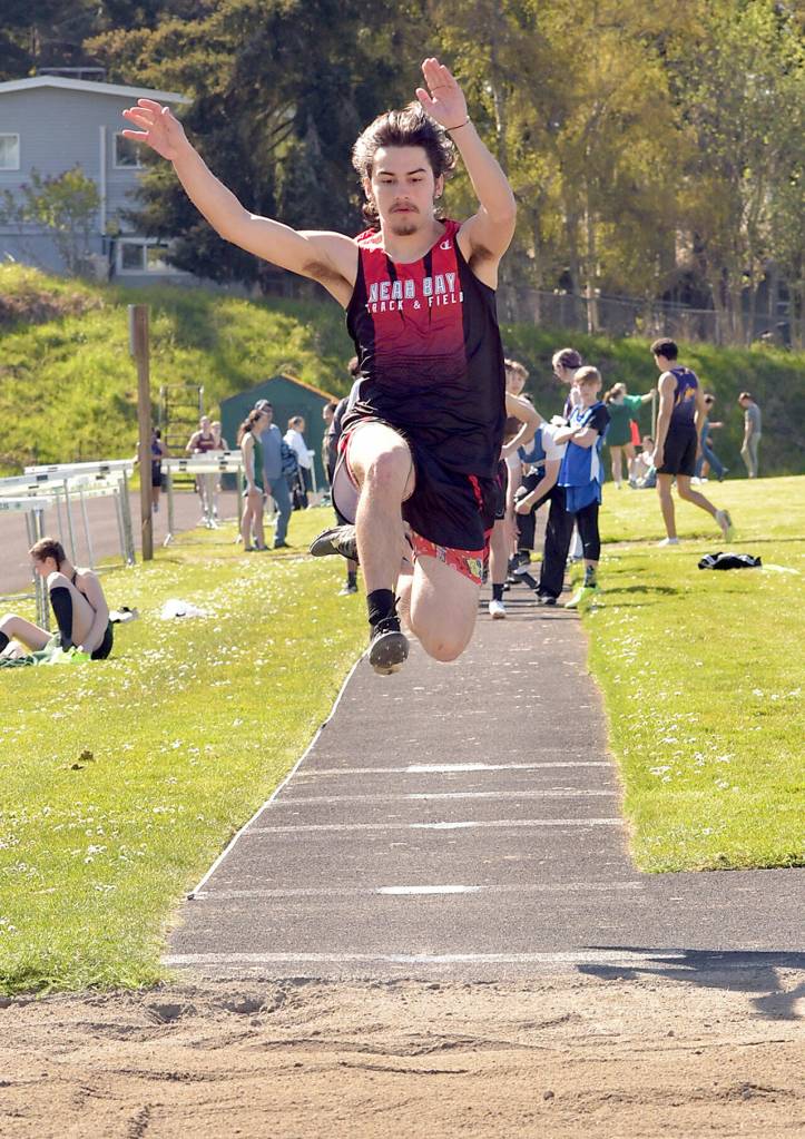 KEITH THORPE/PENINSULA DAILY NEWS Christopher Hottowe of Neah Bay leaps in the boys long jump event on Thursday in Port Angeles.