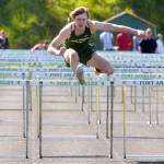 KEITH THORPE/PENINSULA DAILY NEWS Parker Nickerson of Port Angeles leads the way to win the boys 100 hurdles on Thursday on the track at Port Angeles High School.