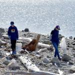 Isaac Wendel, 11, left, and his mother Jennie Wendel of Port Angeles, comb the beach on the inside of Ediz Hook in Port Angeles on Saturday as part of a cleanup effort hosted by Washington CoastSavers in honor of Earth Day. Hundreds of volunteers fanned out across numerous beaches on Washingtons Pacific Coast and along the Strait of Juan de Fuca to collect trash and other unwanted debris. (Keith Thorpe/Peninsula Daily News)