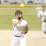 With teammate Taylee Rome looking on, Sequim second baseman Mia Kirner throws out a Klahowya running in a non-league match-up Saturday. Kirner had a home run in the windy game. (Michael Dashiell/Olympic Peninsula News Group)