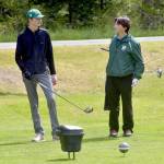KEITH THORPE/PENINSULA DAILY NEWS Reid Schmidt, left, and Cale Wentz, both of Port Angeles, prepare to tee off on the first hole during Tuesdays Duke Streeter Invitational tournament at Peninsula Golf Course in Port Angeles.