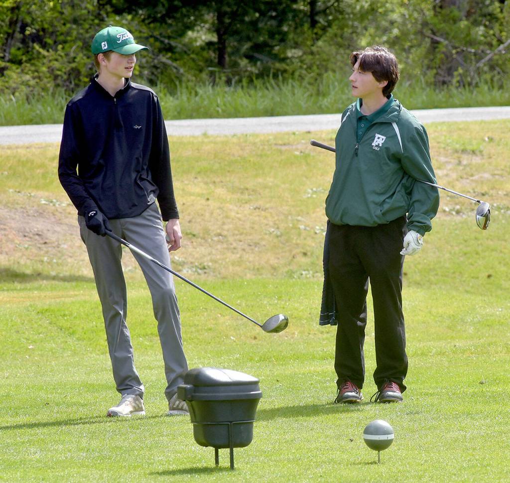KEITH THORPE/PENINSULA DAILY NEWS Reid Schmidt, left, and Cale Wentz, both of Port Angeles, prepare to tee off on the first hole during Tuesdays Duke Streeter Invitational tournament at Peninsula Golf Course in Port Angeles.