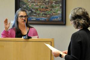 Acting city clerk Heather Robley, right, swears in new city council member Nicole Hartman on Monday after she was appointed to fill former mayor Tom Ferrells seat. Hartman will serve through certification of the 2025 general election. (Matthew Nash/Olympic Peninsula News Group)