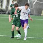 Port Angeles soccer player Cannon Wood (12) is elbowed out of the way by North Kitsaps Ethan Peck (11) Friday night at Wally Sigmar Field at Peninsula College. (Dave Logan/for Peninsula Daily News).
