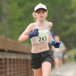 Eleanor Jones, 11, of Sequim wins the Sequim Railroad Run Saturday, taking first among the women in the 5K by two minutes. It was not her first Run the Peninsula first-place medal. (Michael Dashiell/Olympic Peninsula News Group)