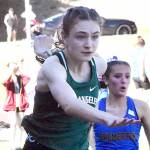 Nicholas Zellar-Singh/Kitsap News Group
Port Angeles' Faerin Tait leaps during the 100-meter hurdles Thursday at the Olympic League Track and Field Championship at North Kitsap High School.