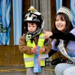 Bryant Volker smiles for Irrigation Festival photographer Keith Ross during the Kids Parade awards with help from festival Princess Kailah Blake. Volker won first place for his bicycle float. (Matthew Nash/Olympic Peninsula News Group)