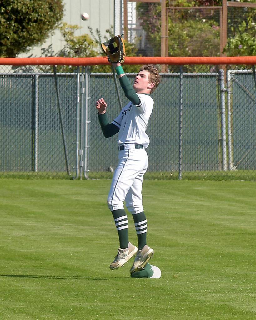 KEITH THORPE/PENINSULA DAILY NEWS Port Angeles centerfielder Nathan Basden catches a high popup during Tuesdays playoff against Fife in Port Angeles.