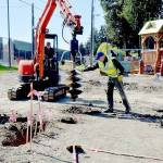 Volunteer Al Oman, right, guides an auger operated by Steve Fink during site preparation for rebuilding the Dream Playground on Wednesday at Erickson Playfield in Port Angeles. A community rebuild is scheduled for May 15-19 to replace portions of the popular playground that were destroyed in an arson fire on Dec. 20. Volunteer signups are available at https://www.padreamplayground.org. The nonprofit Dream Playground Foundation, which organized and orchestrated previous versions of the playground, is also seeking loaner tools with more information available at https://www.signupgenius.com/go/904084DA4AC23A5F85-48241857-dream#/. (Keith Thorpe/Peninsula Daily News)