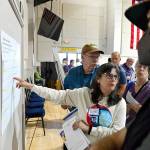 Terrie Comstock of Port Townsend asks questions about a display at the citys kickoff meeting for its 2025 Comprehensive Plan update at the Marvin G. Shields Memorial Post 26 American Legion Hall on Thursday. The meeting was the first in a series for the update, due at the end of 2025 and required by state law. (Peter Segall/Peninsula Daily News)