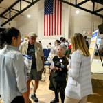 Port Townsend residents speak with city staff members at a public meeting for the citys Comprehensive Plan update due in 2025. The city held an open house meeting at the Marvin G. Shields Memorial Post 26 American Legion Hall where members of the public could ask questions and give feedback about the process. (Peter Segall/Peninsula Daily News)