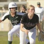 Port Angeles' Ava-Anne Sheahan takes a lead off first base behind Sequim first baseman Ava Ritter on Friday in Sequim. (Michael Dashiell/Olympic Peninsula News Group)