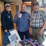 Sarges Veteran Support house managers, from left, Danny Deckert, David Durnford and Steve Elmelund welcome attendees to the organizations first fundraiser at the Dungeness River Nature Center on April 27. The event raised nearly $50,000. (Sarges Veteran Support)