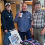 Sarges Veteran Support house managers, from left, Danny Deckert, David Durnford and Steve Elmelund welcome attendees to the organizations first fundraiser at the Dungeness River Nature Center on April 27. The event raised nearly $50,000. (Sarges Veteran Support)