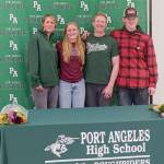 Port Angeles' Harper McGuire, a district champion in the 200 freestyle and 500 freestyle, signed Wednesday to swim for the University of Puget Sound. From left are mother Karry McGuire, Harper McGuire, father Michael McGuire and brother Ronan McGuire. (Pierre LaBossiere/Peninsula Daily News)