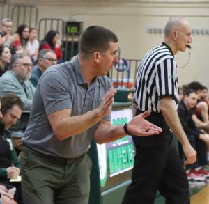 Dave Logan/for Peninsula Daily News 
Port Angeles head coach Kasey Ulin urges his team on from the bench during a contest last season. Ulin will be honored with the Pat Fitterer You Gotta Love It Positive Coach Contributor Award from the Washington Interscholastic Basketball Coaches Association during a ceremony July 17 in Longview.