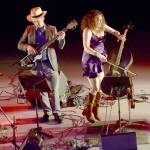 Rebecca Roudman, right, and Colin Williams of the San Francisco Bay area-based Renegade Orchestra take the stage at Field Arts & Events Hall, a Saturday venue of the Juan de Fuca Festival of the Arts. (Keith Thorpe/Peninsula Daily News)
