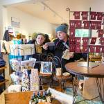 Customers at the Nordland General Store on Marrowstone Island look over cards and other items during a weekend of activities to celebrate the re-opening of the store after it had been closed for six years due to a fire. (Steve Mullensky/for Peninsula Daily News)