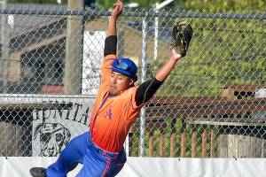 KEITH THORPE/PENINSULA DAILY NEWS
Lefties third baseman Roberto Nunez leaps for a wild throw as Redmond baserunner Charlie Deggeller makes it to the bag on Wednesday's season opener at Port Angeles Civic Field.