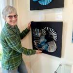 Cathie Wier with a pleated and woven piece on display at the A. Milligan Gallery on North Sequim Avenue.