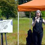Jamie Maciejewski, the executive director of Habitat for Humanity of East Jefferson County, speaks to a crowd of more than 50 people on Thursday at the future site of Habitats affordable housing development in Port Hadlock. Habitat hopes to build at least 150 permanently affordable homes at the site, known as the Mason Street project. (Peter Segall/Peninsula Daily News)
