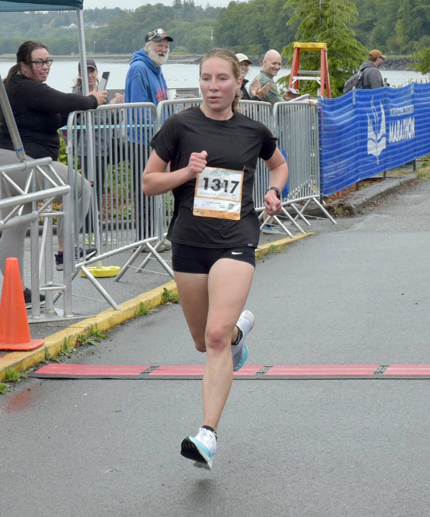 KEITH THORPE/PENINSULA DAILY NEWS Lauren Larson of Port Angeles wins the womens 5K race on Saturday at Port Angeles Civic Pier.