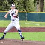 Wilder Senior pitcher Landen Olson of Forks is backed up by his first baseman Brayden White of Sequim as he pitches in the first inning of Wilder's game with Narrows U18 out of Gig Harbor. Narrows won 7-6. (Dave Logan/for Peninsula Daily News)