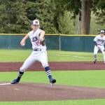 Wilder Senior pitcher Landen Olson of Forks pitches against Narrows 18U on Monday at Volunteer Field with teammate Brayden White (Sequim) at first base. Wilder scored two runs in the ninth but fell just short of a comeback victory in a 7-6 loss. (Dave Logan/for Peninsula Daily News)