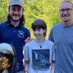 Joseph Molotsky of Discovery Bay Wild Bird Rescue, left, holds an eagle that Annie Espinoza, center, rescued with her friend Kate Burks last month near McDonald Creek. Her uncle, Daniel McMurray, right, drove her to the rescue center the next morning so the bird could be treated. It continues to be treated for a possible hip and/or spinal injury. (Dungeness Bay Wild Bird Rescue)