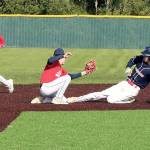 Garret Buerer of the Westport team tries to steal second base on Tuesday night in the Olympic Junior Babe Ruth semifinal, but is put out by Local 155's Ethan Barbee as he slides. Local 155 second baseman Brayden Scott backs up the play. Westport won 4-0 to qualify for the championship game at 5:30 p.m. Tuesday at Volunteer Park, against the winner of Athlete's Choice and First Federal. (Dave Logan/for Peninsula Daily News)